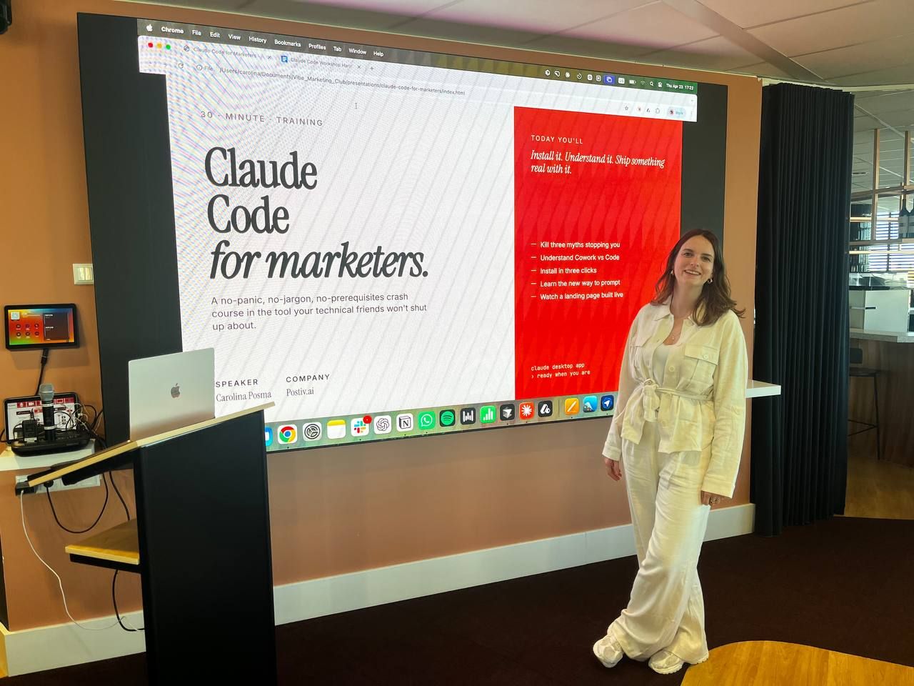 Carolina beside the screen at her Claude Code for marketers training